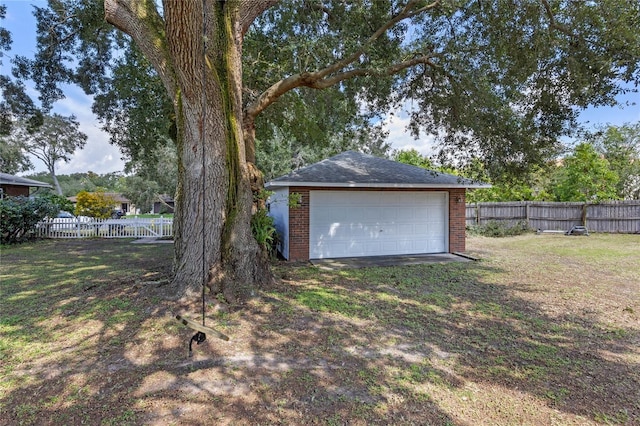 view of yard with a garage and an outdoor structure