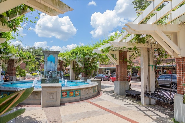 view of patio featuring pool water feature