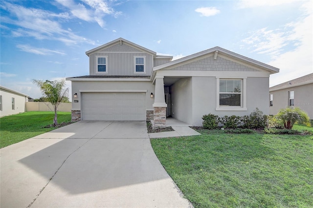 view of front of property featuring a front lawn and a garage