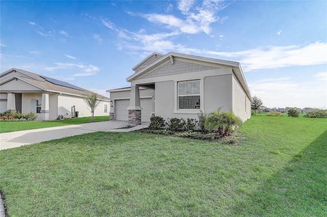 view of front of house with a front lawn and a garage