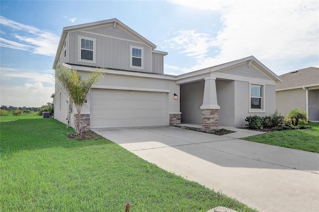 view of front of house with a front yard, a garage, and central air condition unit