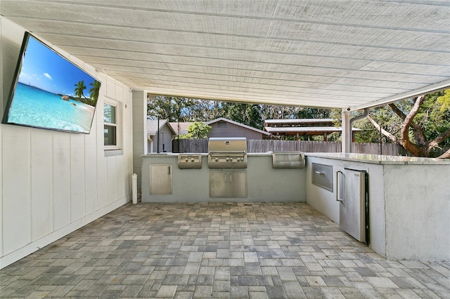 view of patio / terrace with an outdoor kitchen and grilling area