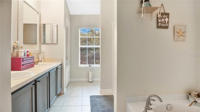 bathroom featuring vanity, a tub, and tile patterned floors