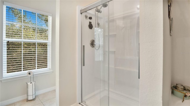 bathroom with tile patterned flooring and an enclosed shower