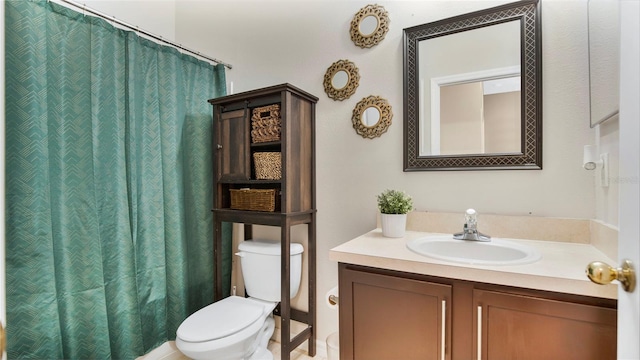 bathroom with vanity, toilet, and a shower with curtain