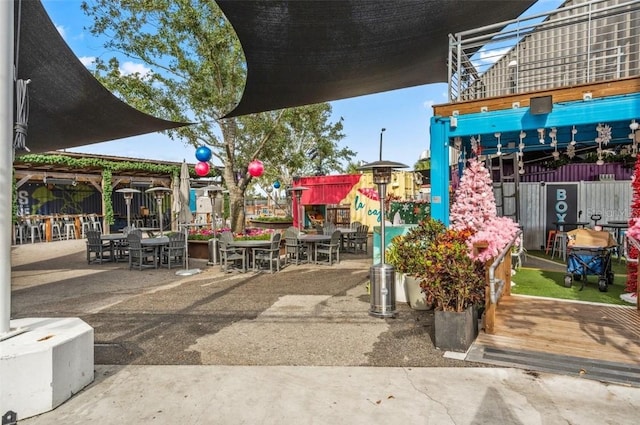 view of property's community with a patio area