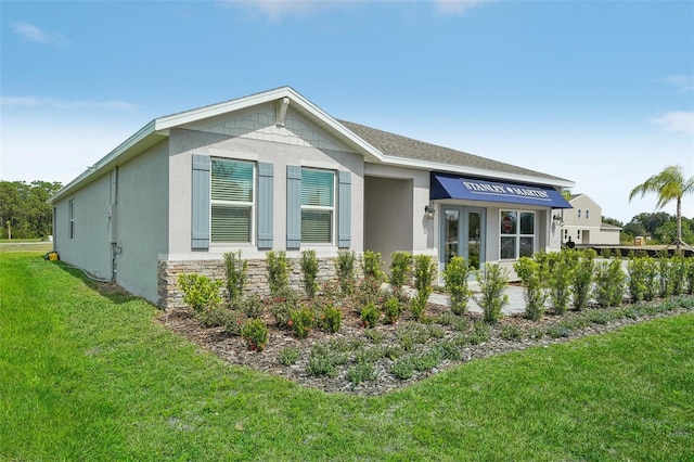 view of home's exterior featuring a lawn