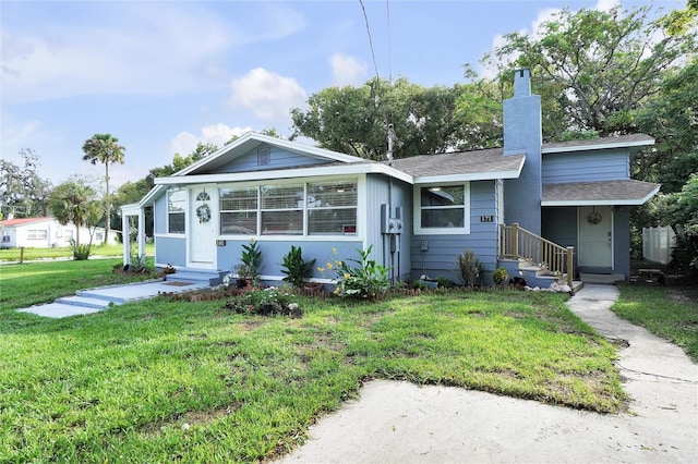 bungalow-style home with a front lawn