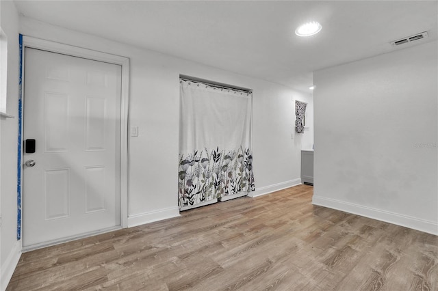 entryway with light hardwood / wood-style floors