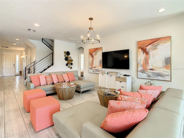 living room featuring a chandelier