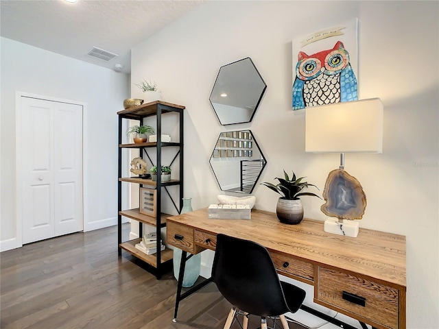 home office with dark hardwood / wood-style flooring