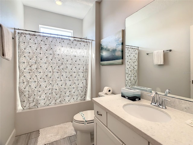 full bathroom with shower / bath combo, vanity, and toilet