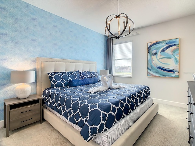 carpeted bedroom with a chandelier