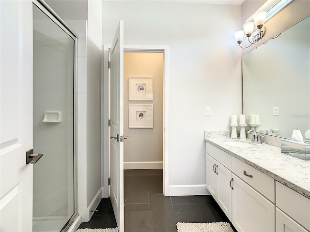 bathroom with tile patterned flooring, vanity, and a shower with door