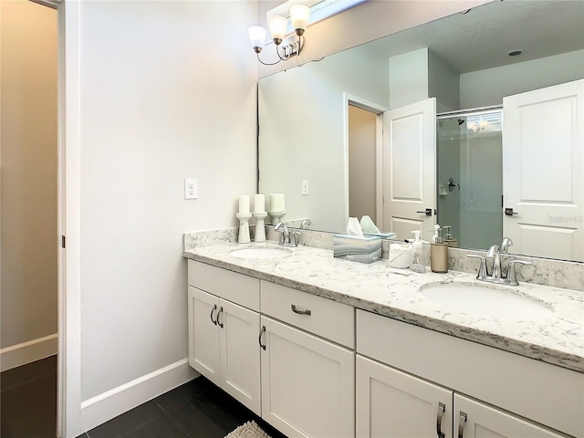 bathroom featuring vanity, tile patterned floors, and an enclosed shower