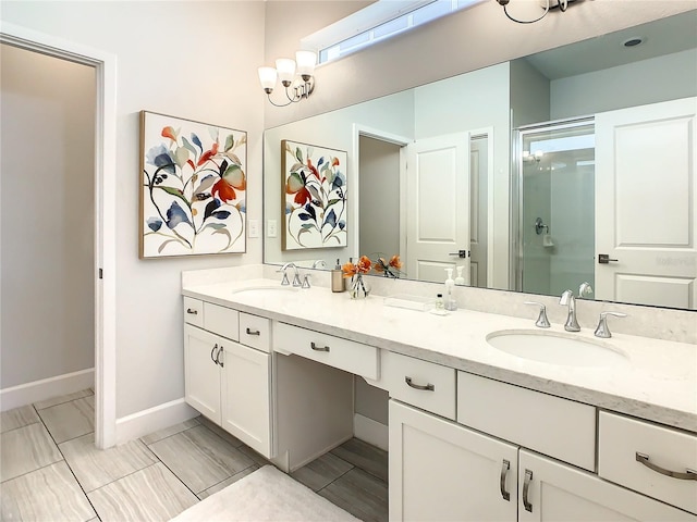 bathroom with walk in shower and vanity