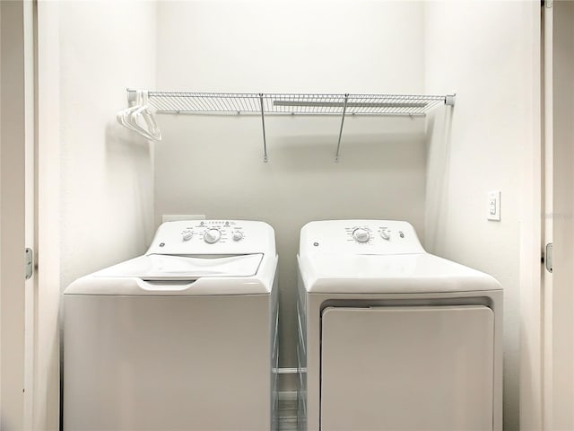 washroom with washing machine and dryer