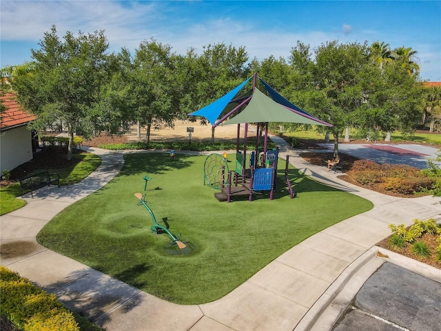 view of playground featuring a lawn