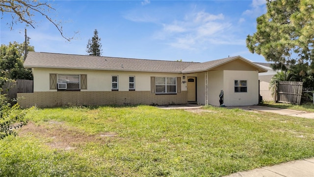 ranch-style house with a front lawn