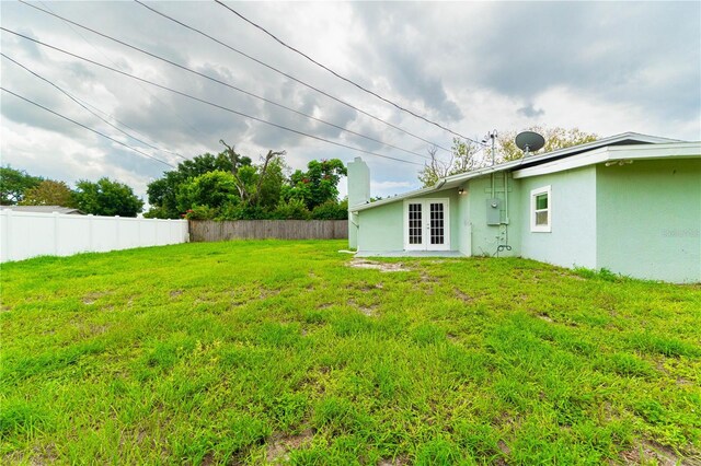 5709 Ridgeway Dr, Orlando, FL 32819 - view of yard featuring french doors and fence