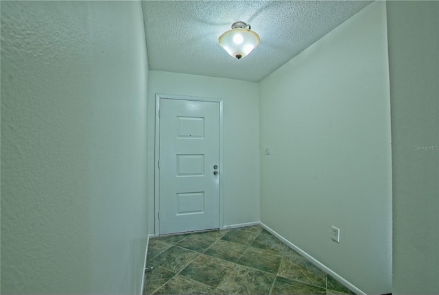 entryway featuring a textured ceiling