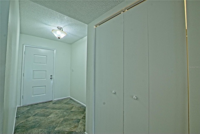 interior space with a textured ceiling