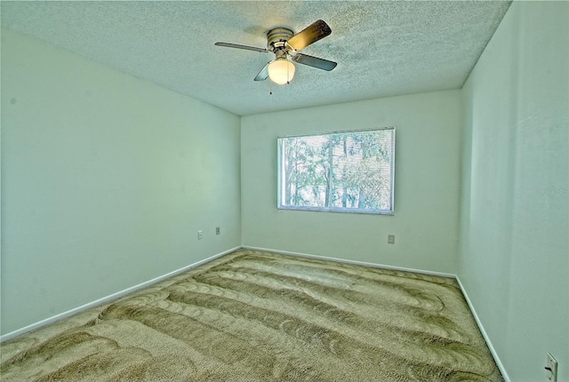 unfurnished room featuring ceiling fan, a textured ceiling, and carpet flooring