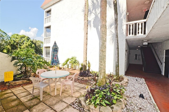 view of patio / terrace with a balcony