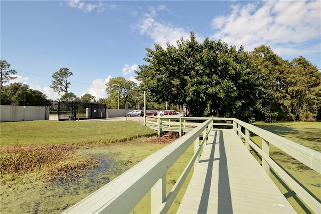 dock area featuring a lawn