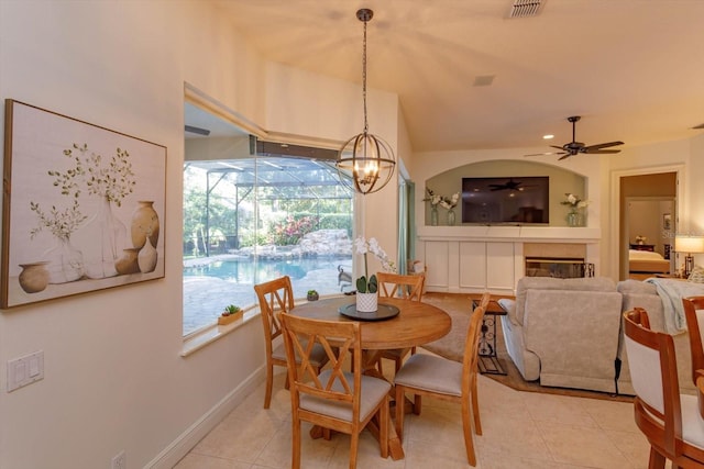 tiled dining area featuring ceiling fan