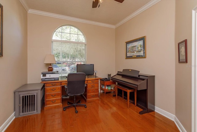 office featuring ornamental molding, wood-type flooring, ceiling fan, and a textured ceiling