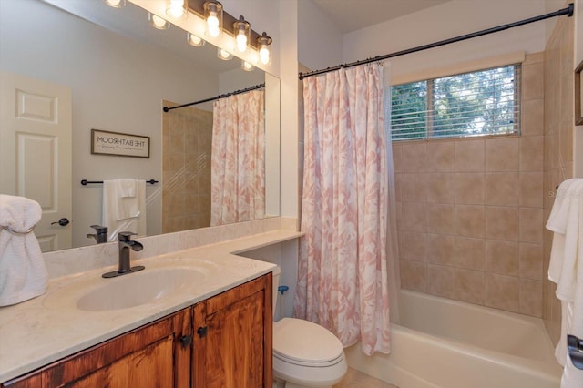 full bathroom featuring vanity, shower / bath combo with shower curtain, and toilet