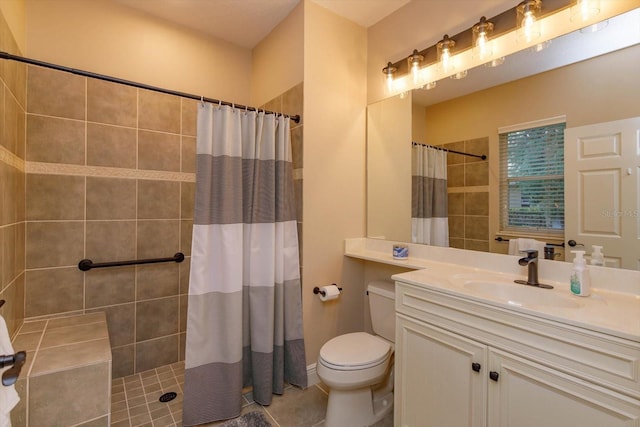 bathroom featuring toilet, vanity, a shower with shower curtain, and tile patterned flooring