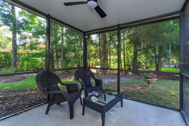 sunroom featuring ceiling fan