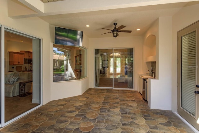 view of patio / terrace featuring ceiling fan