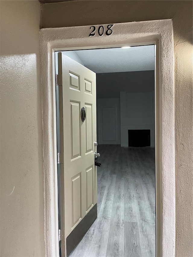 hallway with wood-type flooring