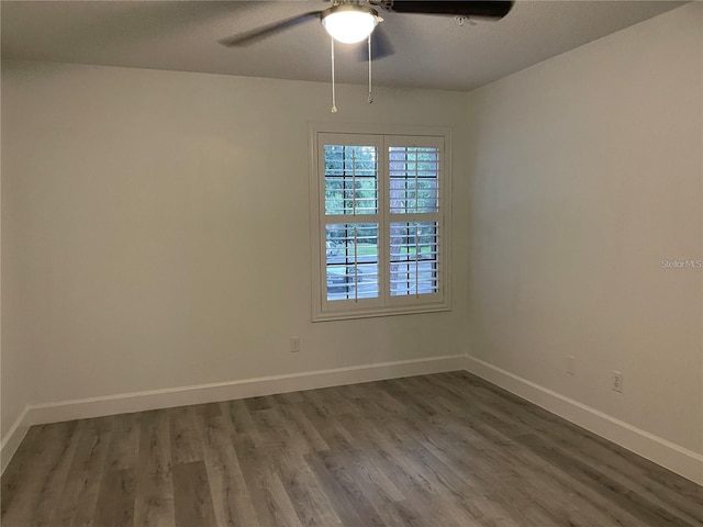 spare room with ceiling fan, a textured ceiling, and hardwood / wood-style floors