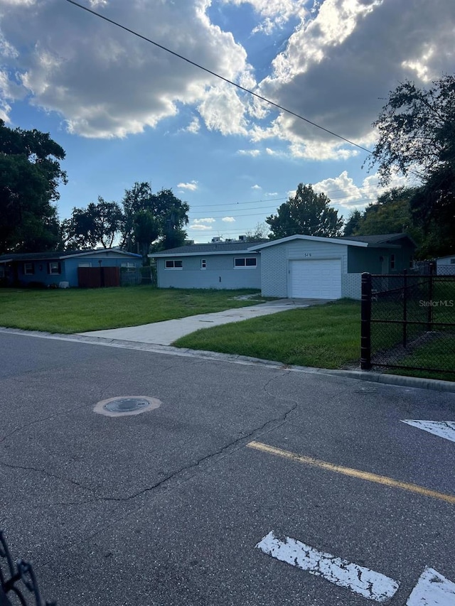 view of front of home featuring a garage and a front yard