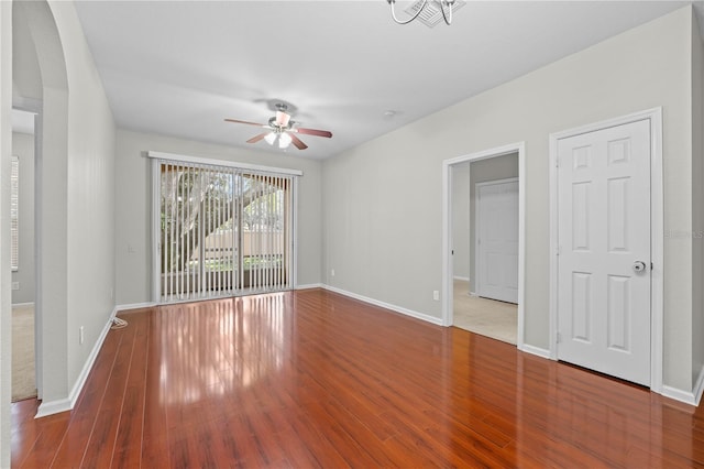 unfurnished bedroom with wood-type flooring and ceiling fan