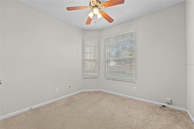 carpeted empty room with ceiling fan