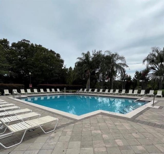 view of pool featuring a patio