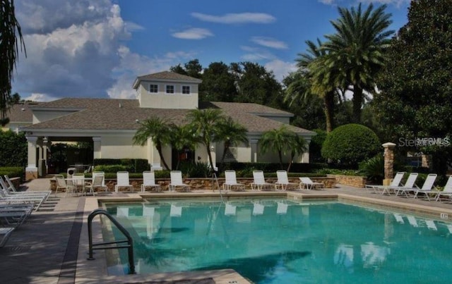 view of swimming pool with a patio