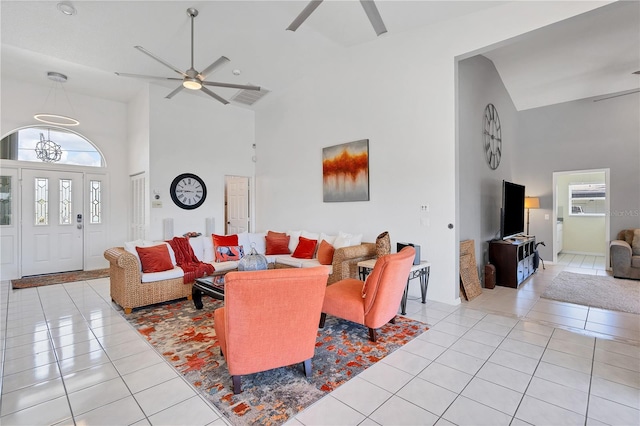 tiled living room with high vaulted ceiling and ceiling fan