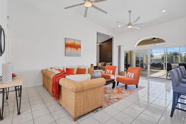 tiled living room with lofted ceiling and ceiling fan