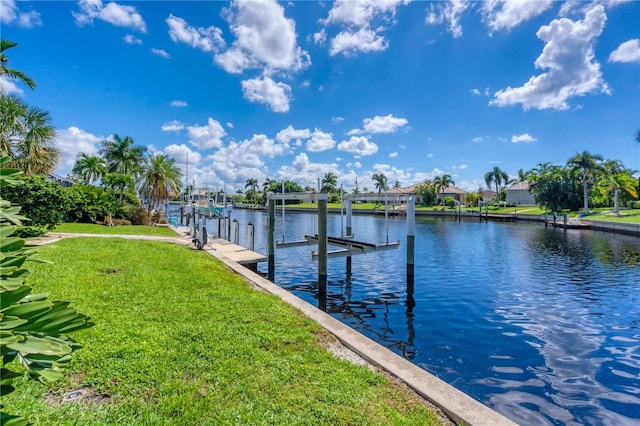 dock area featuring a water view and a yard