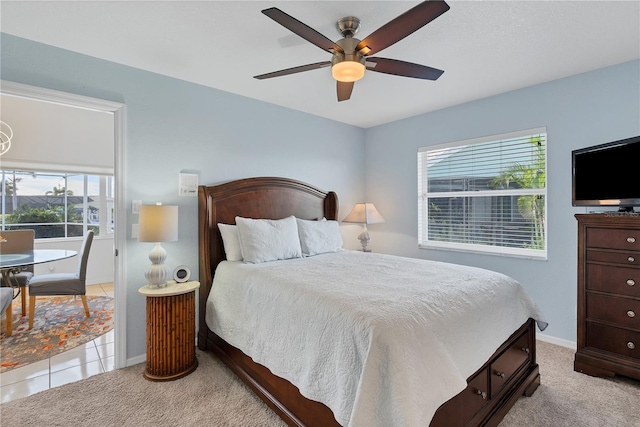 bedroom featuring ceiling fan and light colored carpet