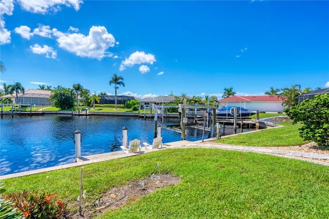 view of dock featuring a lanai, a water view, and a lawn