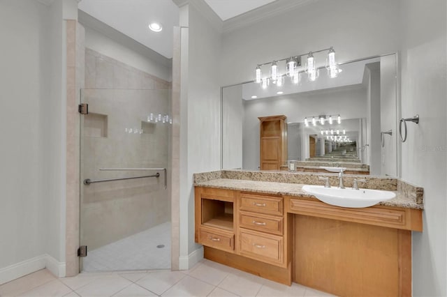 bathroom with tile patterned floors, crown molding, vanity, and an enclosed shower