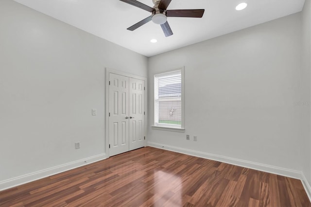 empty room featuring dark hardwood / wood-style floors and ceiling fan