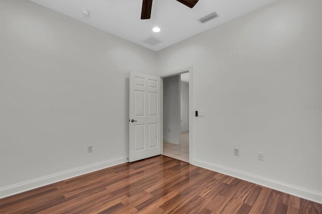 unfurnished room with hardwood / wood-style floors and ceiling fan